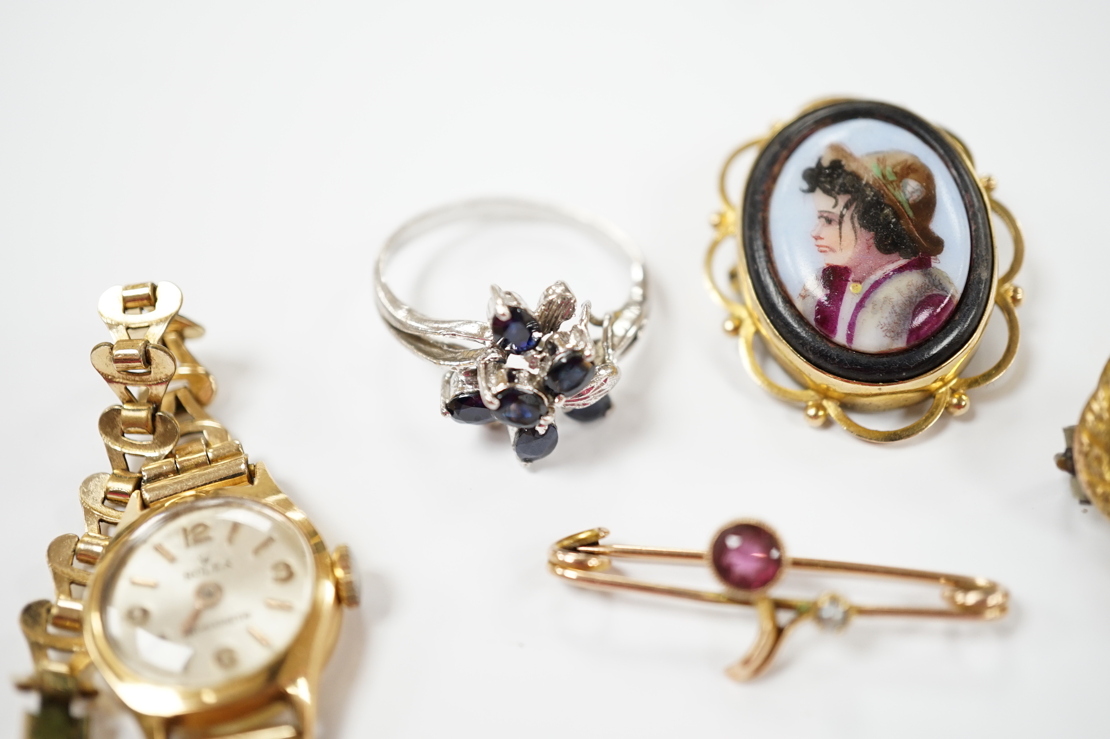 A group of assorted jewellery including a 15ct and single stone amethyst bar brooch, three other yellow metal and gem set bar brooches including two 9ct, a 9ct and enamel brooch, an 18ct watch, a 9ct fob watch and two ot